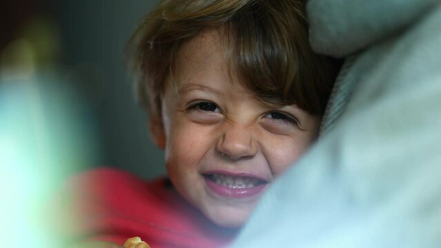 Handsome Happy child smiling at camera, adorable close-up small boy grinning feeling elated