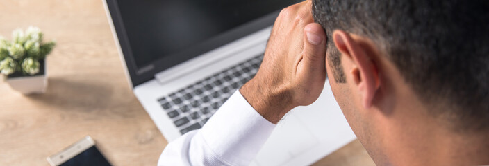 sad man in working desk
