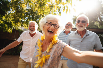 happy seniors enjoying vacation in summer outdoors