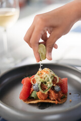 chef preparing lime on a taco