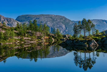 Naklejka na ściany i meble Quietly lake in the mountains with mirroring
