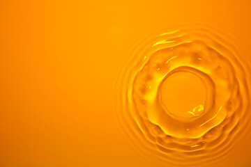 The surface of the water splashes orange