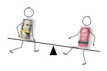 100 US dollars and 100 yuan banknotes on scales. Yuan is the currency of the China. Yuan and Dollar exchange rate