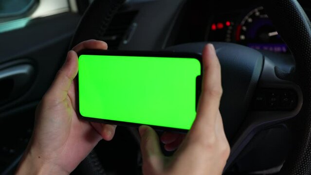 hand holding a car key, green screen phone, using mobile phone at car, holding smartphone at car, hand holding phone on car 
