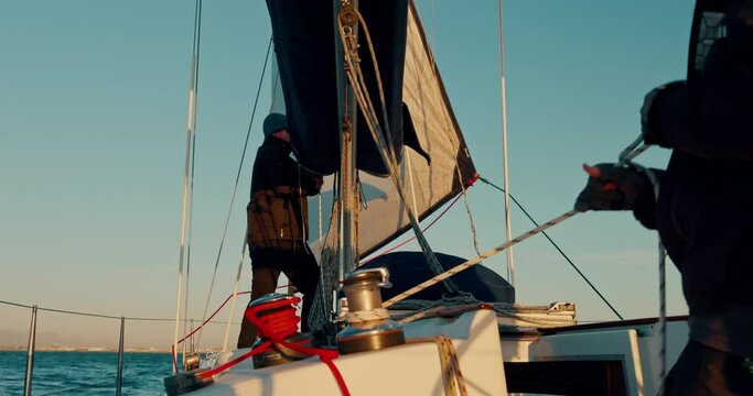 Men, rope and sail for boat by ocean, wind energy and outdoor in summer for vacation, travel or transportation. Sailing crew, yacht or ship with teamwork in harbor, sea or holiday cruise in Monaco