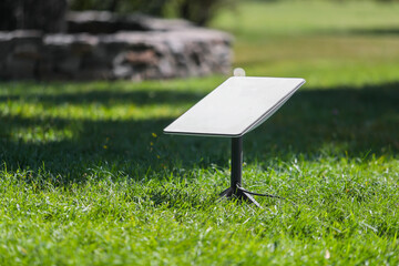 Starlink satellite-based (Satellite internet constellation) on the lawn of the park during the day