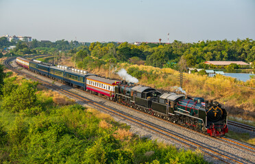 Naklejka premium Special Train Pacific Type Steam Locomotive Traveling Passengers in Thailand