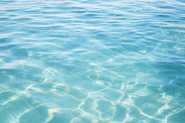 Fototapeta na wymiar A serene and tranquil image showcasing clear blue water ripples. This image is perfect for projects that require a calming and aquatic theme.