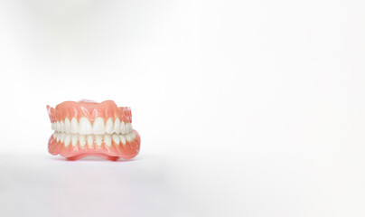 Dentures over white background with copy space. Dental plan. Dentistry prosthesis. Dental Health