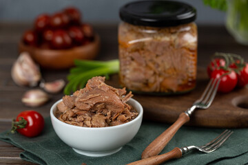 Turkey stew, meat preparations in a glass jar, cooked meat in a bowl