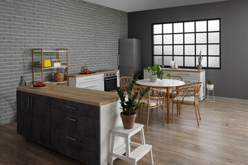 Interior of modern kitchen with dining table, houseplants and kitchen stove