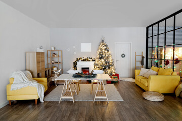 Interior of living room with Christmas tree, sofa, armchair, fireplace and dining table