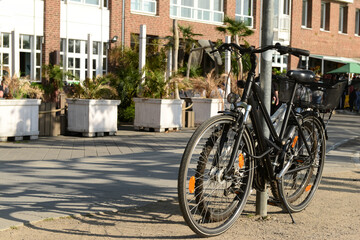 Fototapeta na wymiar Modern bicycle parked on city street
