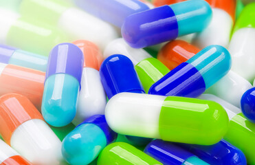 Background of pills of different colors from different diseases and viruses