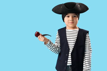 Cute little pirate with smoking pipe on blue background