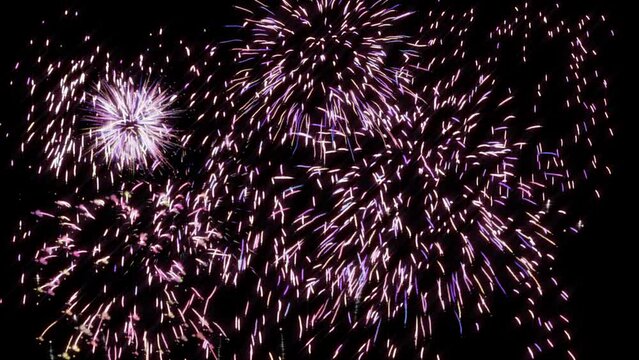 Fireworks with transparent background - Big show of festive celebration with rockets bursting and sparkles in colourful animation with alpha channel for transparency