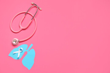 Paper lungs, stethoscope and white ribbon on pink background. Lung cancer concept