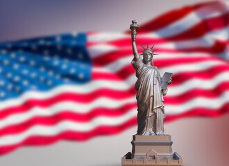 metalic statue of liberty on USA flag