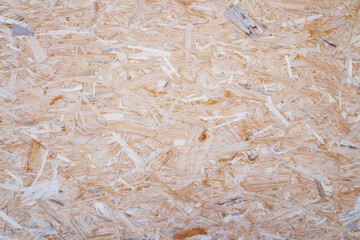 Sheet of plywood, recycled wooden board. Pressed wooden panel background, osb texture