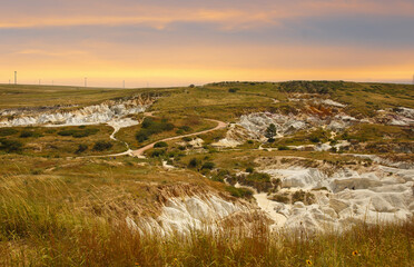 Overview of Paint Mines Interpretive Park at sunset, El Paso County, Colorado. The park is an Unique open space with distinctive color variations & rock formations.