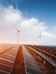 windmill and solar panel farm producing renewable energy with wind and sun