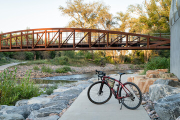 gravel touring bike bike at whitewater park on the Poudre River in downtown of Fort Collins, Colorado, late summer scenery