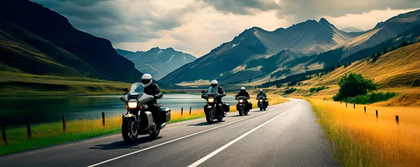  Motorcyclists ride on a winding road against the backdrop of mountains © Александр Марченко