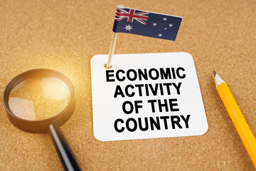 On the table is the flag of Australia and a sheet of paper with the inscription - economic activity...