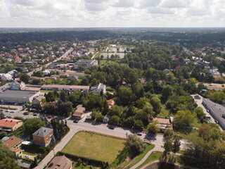Grodzisk Mazowiecki z lotu ptaka latem/Grodzisk Mazowiecki city aerial view in summer, Mazovia, Poland - obrazy, fototapety, plakaty