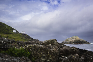 Morning View from Krakenes Beach Near Måløy, Norway with Lighthouse Homes and Sea