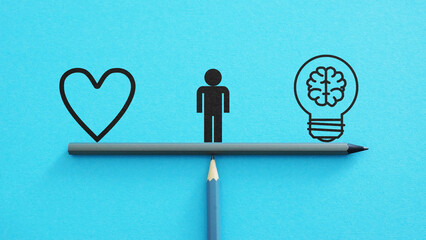 Intuition versus Logic or the common sense are shown using the pictures of the heart and the lamp...