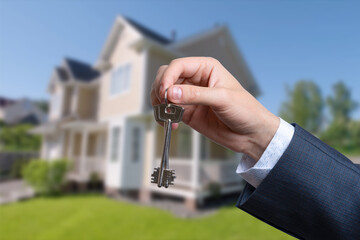 Man hand holding on finger keys to new house.