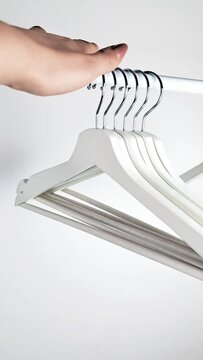 white crossbar hanger minimalistic video,shopping concept. High quality FullHD footage