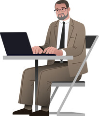 bearded man in suit working on laptop