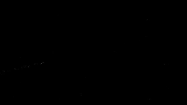 A line of satellites moving across the night sky 