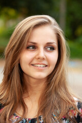 Portrait of a young beautiful girl in the park