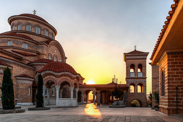 Monastery of Dormition of Holy Mary (Panagia Evrou) Orthodox Monastery, Makri Evros Greece, catholic church in Byzantine style, sunset colors - obrazy, fototapety, plakaty