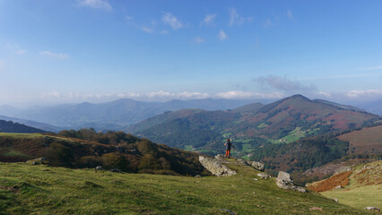 Hiking in beautiful basque countryside with meadow on the hill at the spanish french border near...