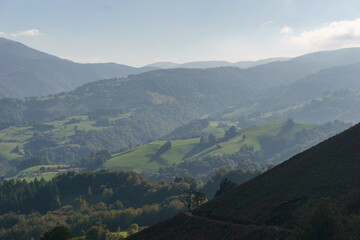 Beautiful basque countryside with green hills in golden sunlight at the spanish french border near...