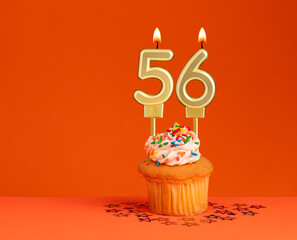 Number 56 candle - Birthday card design in orange background