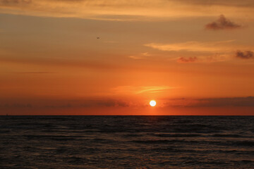 Scenic sunset over the sea. Calm Baltic sea. Poland seaside, Leba village and beach. Seascape