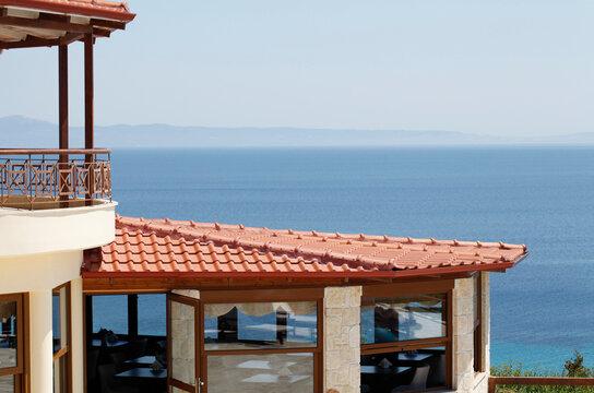 Beautiful balcony of a house and tile roof with a restaurant downstairs