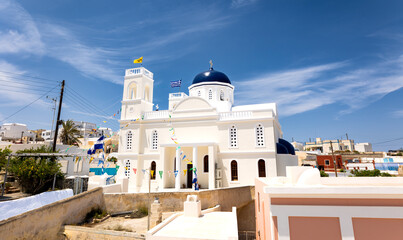 Santorini, Greece - 05 25 2023: Greek orthodox church in Karterádos in the traditional white color...