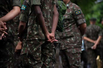 Army soldiers await the start of the Brazilian independence parade in the city of Salvador, Bahia.