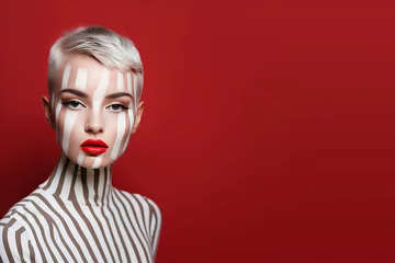 Poster Portrait of a pretty woman with zebra pattern make up. Fashion, make up, skincare background with copy space © hiddencatch