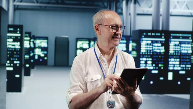 Senescent employee expertly managing data while navigating through industrial server rows. Octogenarian worker ensuring smooth cybersecurity protection, optimizing systems