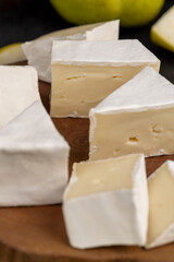 cheese with white mold cut into chunks