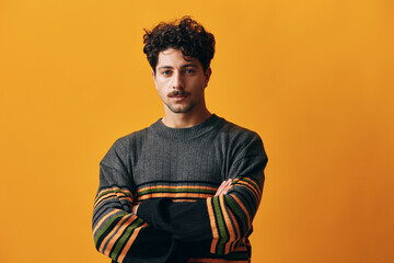 Fashion man male sweater posing portrait smile orange trendy winter student happy background...