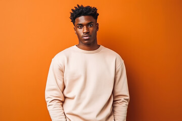 Obraz premium Portrait of handsome african american male looking serious in casual clothes on a colored background