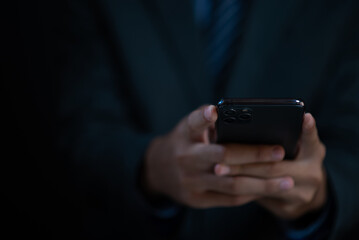 Business man holding a smart phone